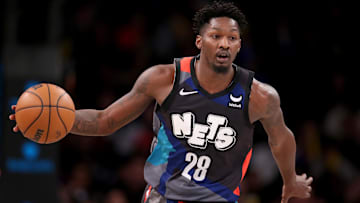 Dec 20, 2023; Brooklyn, New York, USA; Brooklyn Nets forward Dorian Finney-Smith (28) brings the ball up court against the New York Knicks during the fourth quarter at Barclays Center. Mandatory Credit: Brad Penner-Imagn Images