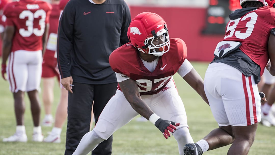 Apr 2, 2026; Fayetteville, AR, USA;  Arkansas Razorbacks defensive lineman Quincy Rhodes (97) runs a drill during spring practice at the Arkansas Razorbacks practice facilities. Mandatory Credit: Brett Rojo-Imagn Images