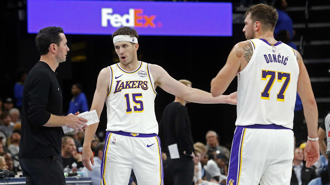 Oct 31, 2025; Memphis, Tennessee, USA; Los Angeles Lakers head coach JJ Redick talks with guard Austin Reaves (15) and guard Luka Doncic (77) during the fourth quarter against the Memphis Grizzlies at FedExForum. Mandatory Credit: Petre Thomas-Imagn Images Oct 31, 2025; Memphis, Tennessee, USA; Los Angeles Lakers head coach JJ Redick talks with guard Austin Reaves (15) and guard Luka Doncic (77) during the fourth quarter against the Memphis Grizzlies at FedExForum. Mandatory Credit: Petre Thomas-Imagn Images
