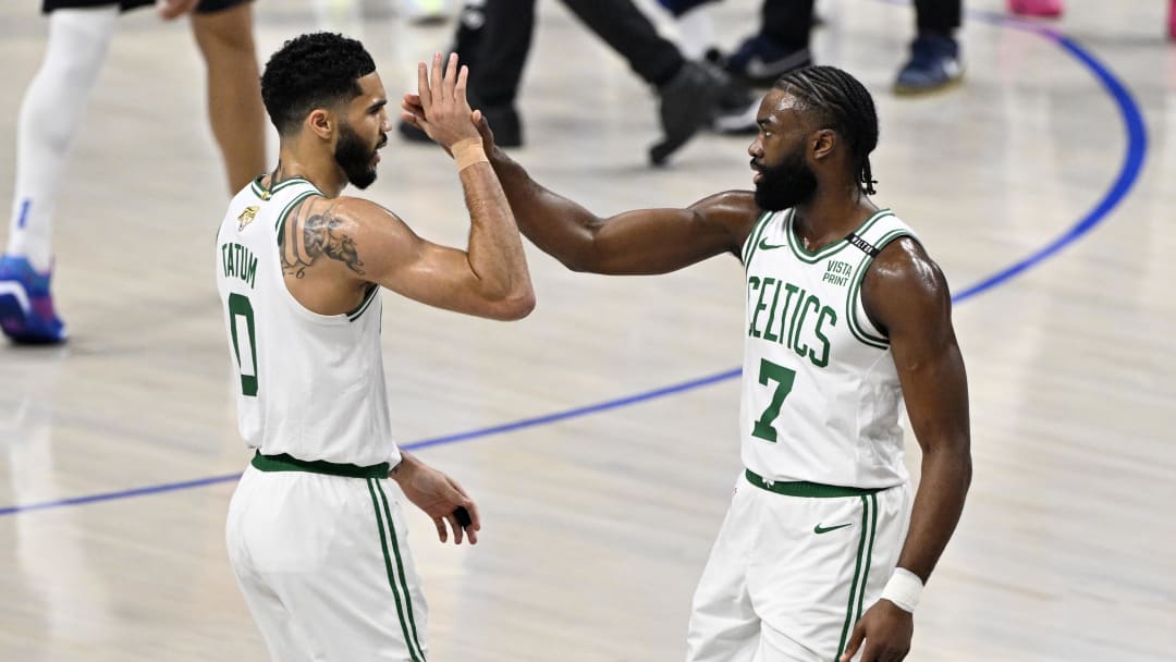 Jun 12, 2024; Dallas, Texas, USA; Boston Celtics forward Jayson Tatum (0) and guard Jaylen Brown (7) celebrate after a play during the first quarter in game three of the 2024 NBA Finals against the Dallas Mavericks at American Airlines Center. Mandatory Credit: Jerome Miron-USA TODAY Sports