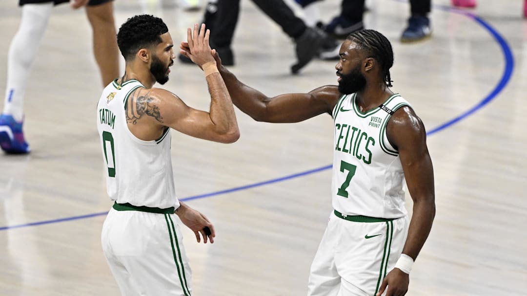 Jun 12, 2024; Dallas, Texas, USA; Boston Celtics forward Jayson Tatum (0) and guard Jaylen Brown (7) celebrate after a play during the first quarter in game three of the 2024 NBA Finals against the Dallas Mavericks at American Airlines Center. Mandatory Credit: Jerome Miron-Imagn Images Jun 12, 2024; Dallas, Texas, USA; Boston Celtics forward Jayson Tatum (0) and guard Jaylen Brown (7) celebrate after a play during the first quarter in game three of the 2024 NBA Finals against the Dallas Mavericks at American Airlines Center. Mandatory Credit: Jerome Miron-Imagn Images