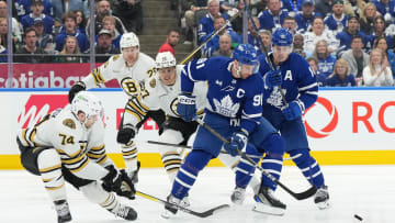 Apr 27, 2024; Toronto, Ontario, CAN; Toronto Maple Leafs center John Tavares (91) battles for the puck with Boston Bruins left wing Jake DeBrusk (74) during the first period in game four of the first round of the 2024 Stanley Cup Playoffs at Scotiabank Arena. Mandatory Credit: Nick Turchiaro-USA TODAY Sports