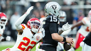 Oct 27, 2024; Paradise, Nevada, USA; Kansas City Chiefs cornerback Trent McDuffie (22) looks to sack Las Vegas Raiders quarterback Gardner Minshew (15) during the second quarter at Allegiant Stadium. Mandatory Credit: Stephen R. Sylvanie-Imagn Images