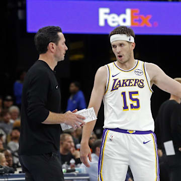 Oct 31, 2025; Memphis, Tennessee, USA; Los Angeles Lakers head coach JJ Redick talks with guard Austin Reaves (15) and guard Luka Doncic (77) during the fourth quarter against the Memphis Grizzlies at FedExForum. Mandatory Credit: Petre Thomas-Imagn Images