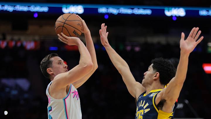Feb 28, 2025; Miami, Florida, USA; Miami Heat forward Duncan Robinson (55) shoots the basketball over Indiana Pacers guard Ben Sheppard (26) during the fourth quarter at Kaseya Center. Mandatory Credit: Sam Navarro-Imagn Images