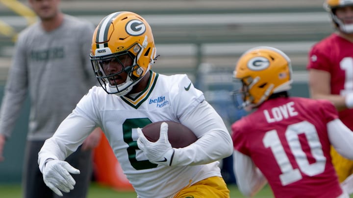 Jun 11, 2024; Green Bay, WI, USA; Green Bay Packers running back Josh Jacobs (8) carries during minicamp. Mandatory Credit: Mark Hoffman-USA TODAY Sports