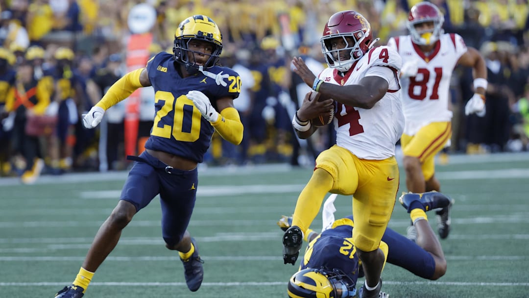 USC Trojans running back Woody Marks (4) runs while defended by Michigan Wolverines defensive back Jyaire Hill (20) USC Trojans running back Woody Marks (4) runs while defended by Michigan Wolverines defensive back Jyaire Hill (20)
