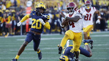 USC Trojans running back Woody Marks (4) runs while defended by Michigan Wolverines defensive back Jyaire Hill (20)