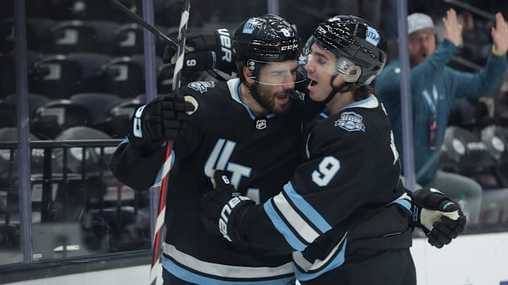 Jan 31, 2025; Salt Lake City, Utah, USA;  Utah Hockey Club center Nick Schmaltz (8) and center Clayton Keller (9) celebrate a Schmaltz goal during the second period against the Columbus Blue Jackets at Delta Center. Mandatory Credit: Chris Nicoll-Imagn Images