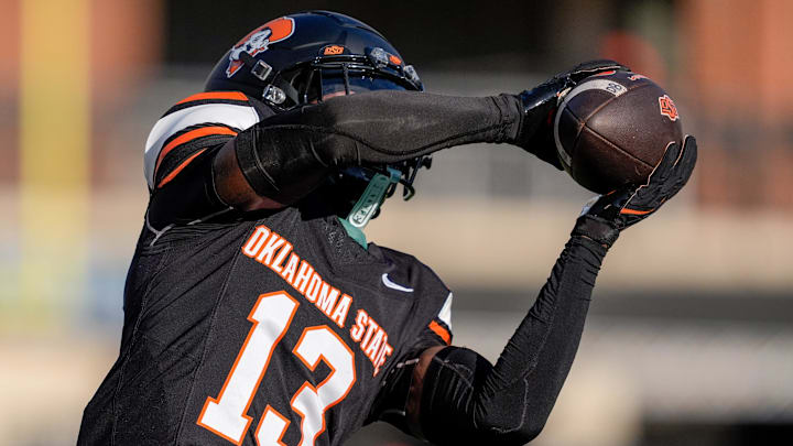 Oklahoma State cornerback Eric Fletcher warms up before an NCAA football game against Tulsa.