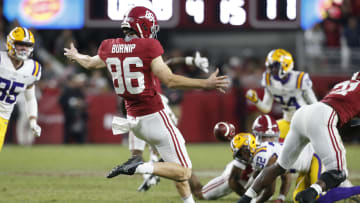 Nov 6, 2021; Tuscaloosa, Alabama, USA;  Alabama Crimson Tide punter James Burnip (86) punts against the LSU Tigers at Bryant-Denny Stadium. Alabama won 20-14. Mandatory Credit: Gary Cosby Jr.-USA TODAY Sports