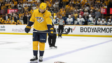 May 3, 2024; Nashville, Tennessee, USA; Nashville Predators defenseman Roman Josi (59) stares a catfish against the Vancouver Canucks during the third period in game six of the first round of the 2024 Stanley Cup Playoffs at Bridgestone Arena. Mandatory Credit: Steve Roberts-USA TODAY Sports