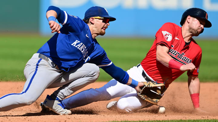 Aug 28, 2024; Cleveland, Ohio, USA; Cleveland Guardians pinch runner Lane Thomas (8) steals second as Kansas City Royals shortstop Bobby Witt Jr. (7) misses the throw during the eighth inning at Progressive Field. Mandatory Credit: Ken Blaze-USA TODAY Sports