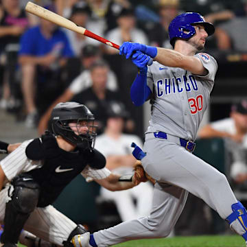 Jul 26, 2025; Chicago, Illinois, USA; Chicago Cubs right fielder Kyle Tucker (30) hits a single during the ninth inning against the Chicago White Sox at Rate Field. 