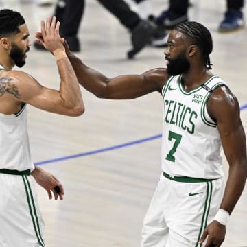 Jun 12, 2024; Dallas, Texas, USA; Boston Celtics forward Jayson Tatum (0) and guard Jaylen Brown (7) celebrate after a play during the first quarter in game three of the 2024 NBA Finals against the Dallas Mavericks at American Airlines Center. Mandatory Credit: Jerome Miron-USA TODAY Sports