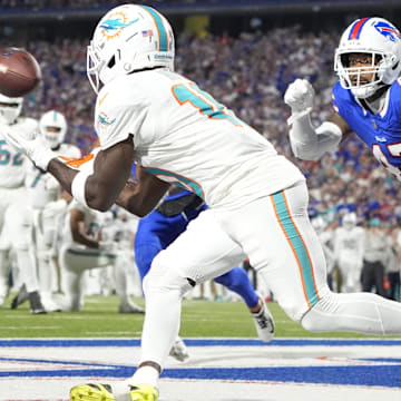 Sep 18, 2025; Orchard Park, New York, USA;  Miami Dolphins wide receiver Tyreek Hill (10) makes a catch to score a touchdown against Buffalo Bills cornerback Christian Benford (47)