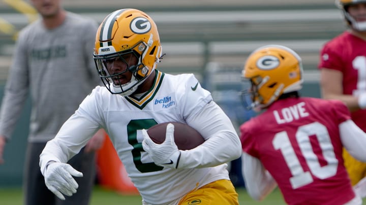 Packers running back Josh Jacobs (8) carries during minicamp.