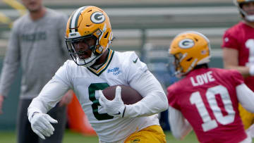 Jun 11, 2024; Green Bay, WI, USA; Green Bay Packers running back Josh Jacobs (8) carries during minicamp. Mandatory Credit: Mark Hoffman-USA TODAY Sports