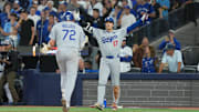Nov 1, 2025; Toronto, Ontario, CAN; Los Angeles Dodgers two-way player Shohei Ohtani (17) reacts as second baseman Miguel Rojas (72) hits a home run against the Toronto Blue Jays in the ninth inning for game seven of the 2025 MLB World Series at Rogers Centre. Mandatory Credit: Nick Turchiaro-Imagn Images