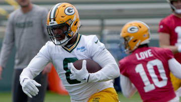 Jun 11, 2024; Green Bay, WI, USA; Green Bay Packers running back Josh Jacobs (8) carries during minicamp. Mandatory Credit: Mark Hoffman-USA TODAY Sports