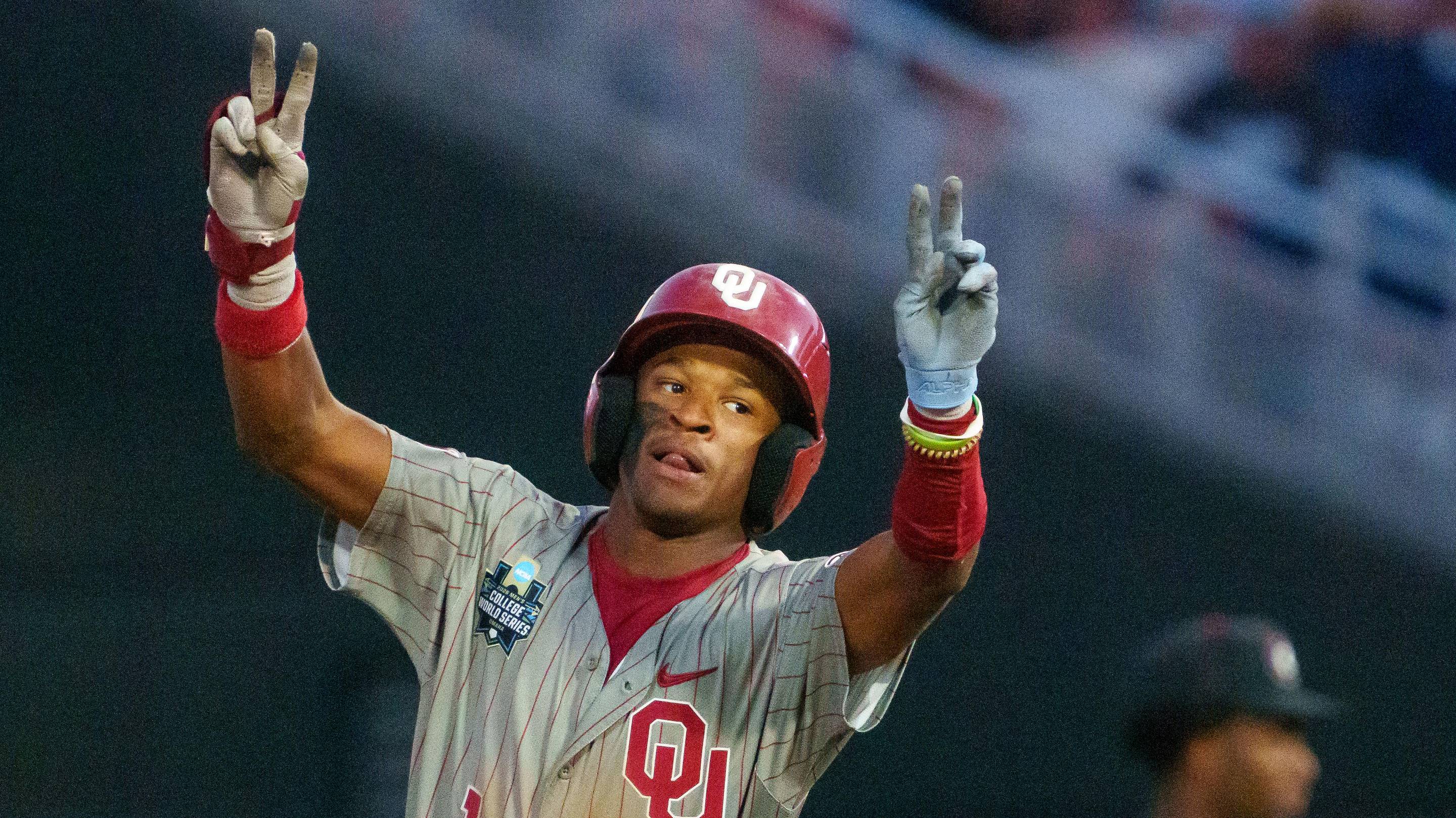 Oklahoma Sooners center fielder Jason Walk (1) celebrates after hitting a home run against the Georgia Bulldogs.