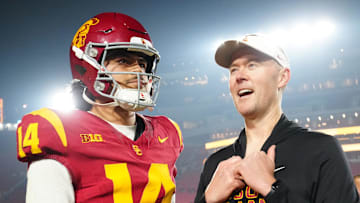 Nov 29, 2025; Los Angeles, California, USA; Southern California Trojans quarterback Jayden Maiava (14) and head coach Lincoln Riley react after the game against the UCLA Bruins at United Airlines Field at Los Angeles Memorial Coliseum. 