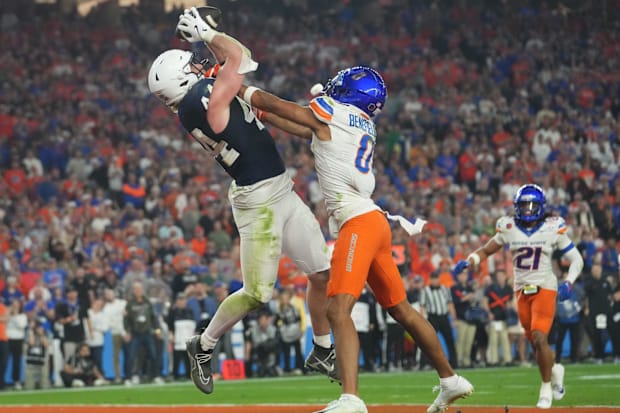 Penn State Nittany Lions tight end Tyler Warren catches a touchdown pass over Boise State Broncos safety Ty Benefield.
