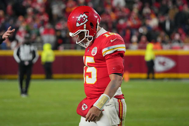 A dejected Patrick Mahomes walks off the field