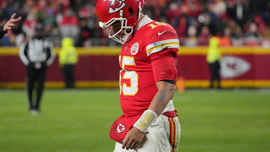 A dejected Patrick Mahomes walks off the field