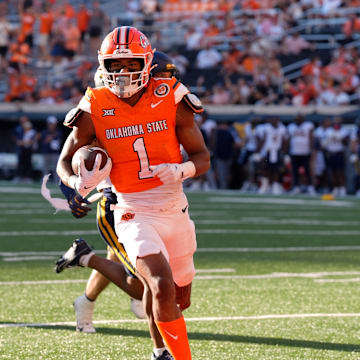 Oklahoma State Cowboys wide receiver De'Zhaun Stribling (1) scores a touchdown during a college football game between the Oklahoma State Cowboys (OSU) and the West Virginia Mountaineers at Boone Pickens Stadium in Stillwater, Okla., Saturday, Oct. 5, 2024.