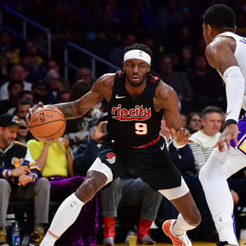 Jan 21, 2024; Los Angeles, California, USA; Portland Trail Blazers forward Jerami Grant (9) controls the ball against Los Angeles Lakers forward Rui Hachimura (28) during the first half at Crypto.com Arena. Mandatory Credit: Gary A. Vasquez-USA TODAY Sports