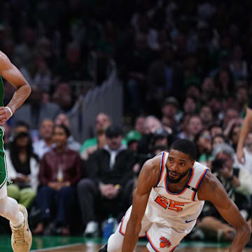 May 7, 2025; Boston, Massachusetts, USA; Boston Celtics guard Derrick White (9) and New York Knicks forward Mikal Bridges (25) work for the ball in the second quarter during game two of the second round for the 2025 NBA Playoffs at TD Garden. Mandatory Credit: David Butler II-Imagn Images