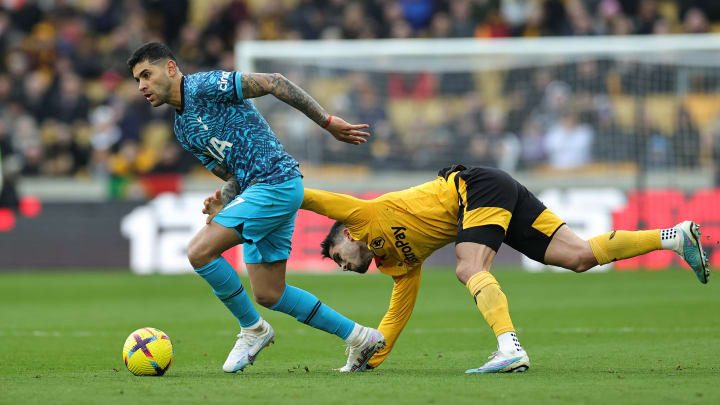 Pedro Neto tries and fails to get the ball of Cristian Romero - Wolverhampton Wanderers v Tottenham Hotspur - Premier League