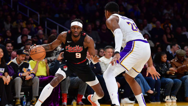 Jan 21, 2024; Los Angeles, California, USA; Portland Trail Blazers forward Jerami Grant (9) controls the ball against Los Angeles Lakers forward Rui Hachimura (28) during the first half at Crypto.com Arena. Mandatory Credit: Gary A. Vasquez-USA TODAY Sports