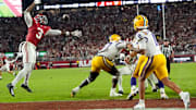LSU quarterback Michael Van Buren Jr. (11) threads a pass by Alabama defensive back Keon Sabb (3) at Saban Field at Bryant-Denny Stadium. Alabama defeated LSU 20-9. 