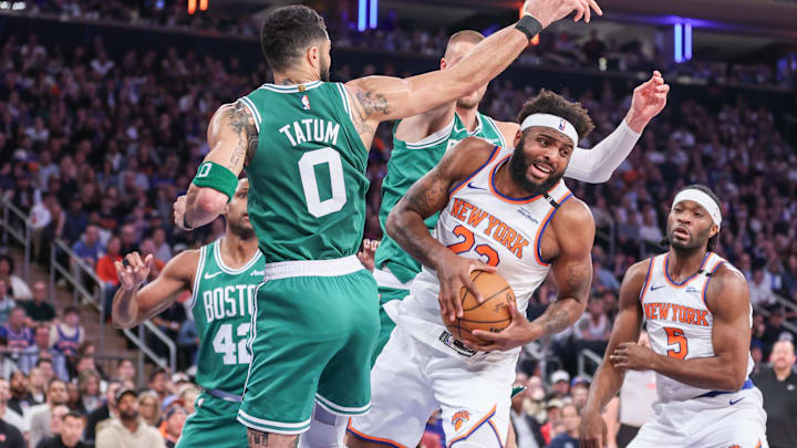 May 10, 2025; New York, New York, USA; New York Knicks center Mitchell Robinson (23) grabs a rebound away from Boston Celtics forward Jayson Tatum (0) in the first quarter during game three of the second round for the 2025 NBA Playoffs at Madison Square Garden. Mandatory Credit: Wendell Cruz-Imagn Images May 10, 2025; New York, New York, USA; New York Knicks center Mitchell Robinson (23) grabs a rebound away from Boston Celtics forward Jayson Tatum (0) in the first quarter during game three of the second round for the 2025 NBA Playoffs at Madison Square Garden. Mandatory Credit: Wendell Cruz-Imagn Images