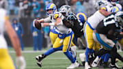 Nov 30, 2025; Charlotte, North Carolina, USA; Los Angeles Rams quarterback Matthew Stafford (9) is sacked by Carolina Panthers defensive end Derrick Brown (95) during the fourth quarter at Bank of America Stadium. Mandatory Credit: Scott Kinser-Imagn Images