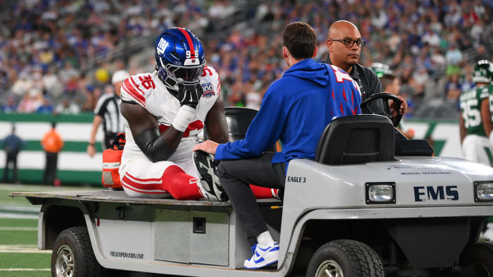 Aug 24, 2024; East Rutherford, New Jersey, USA; New York Giants defensive tackle Timmy Horne (96) is carted off the field after being injured against the New York Jets during the first half at MetLife Stadium.  