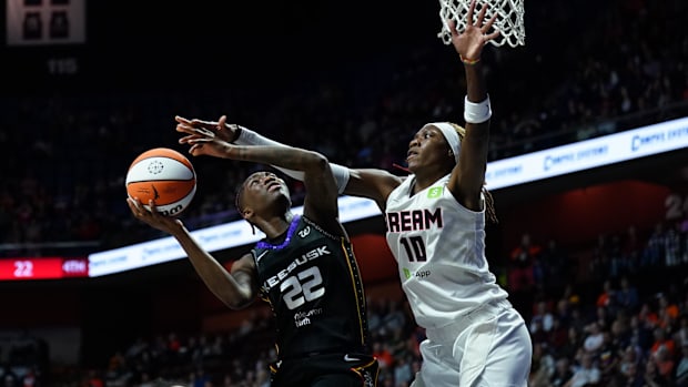 Atlanta Dream guard Rhyne Howard defends against Connecticut Sun guard Saniya Rivers