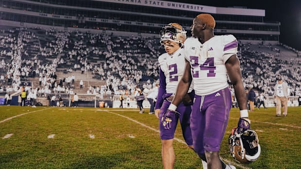 Demond Williams Jr. and Adam Mohammed, then freshmen of the future for the UW, leave the field at Penn State. 