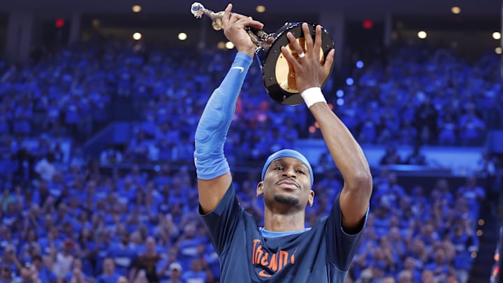 May 22, 2025; Oklahoma City, Oklahoma, USA; NBA commissioner is Adam Silver presents Oklahoma City Thunder guard Shai Gilgeous-Alexander (2) with the Michael Jordan Trophy for winning the most valuable player award for the 2024-25 season before game two of the western conference finals for the 2025 NBA Playoffs at Paycom Center. Mandatory Credit: Alonzo Adams-Imagn Images