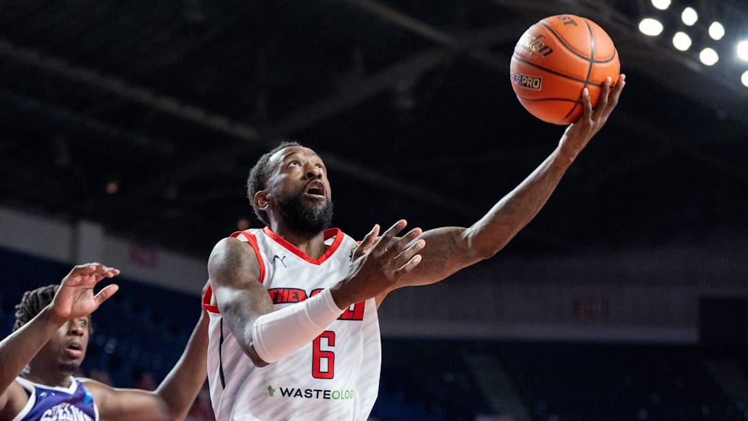 The Ville's Russ Smith (6) goes for a layup against Sideline Cancer's Marcellus Earlington (11) during their game on Monday, July 22, 2024 in Louisville, Ky. at Freedom Hall during the second round of The Basketball Tournament. The Ville's Russ Smith (6) goes for a layup against Sideline Cancer's Marcellus Earlington (11) during their game on Monday, July 22, 2024 in Louisville, Ky. at Freedom Hall during the second round of The Basketball Tournament.