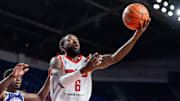 The Ville's Russ Smith (6) goes for a layup against Sideline Cancer's Marcellus Earlington (11) during their game on Monday, July 22, 2024 in Louisville, Ky. at Freedom Hall during the second round of The Basketball Tournament.