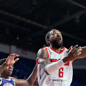 The Ville's Russ Smith (6) goes for a layup against Sideline Cancer's Marcellus Earlington (11) during their game on Monday, July 22, 2024 in Louisville, Ky. at Freedom Hall during the second round of The Basketball Tournament.