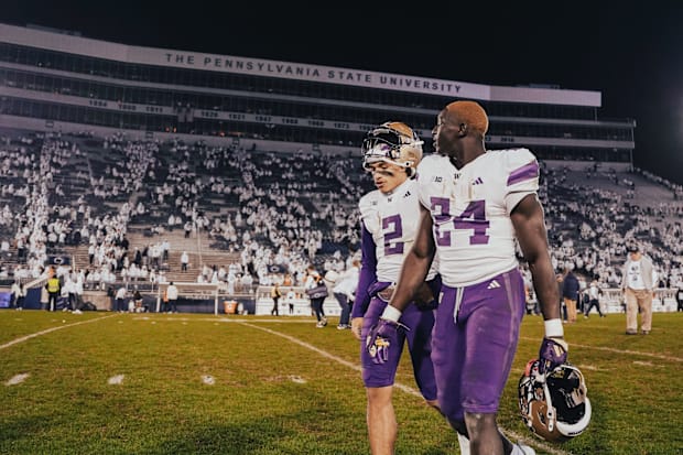Demond Williams Jr. and Adam Mohammed, players of the future for the UW, leave the field at Penn State. 