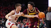 Mar 9, 2025; Piscataway, New Jersey, USA; Rutgers Scarlet Knights guard Jordan Derkack (0) deflects the ball away from Minnesota Golden Gophers guard Mike Mitchell Jr. (2) during the first half at Jersey Mike's Arena. Mandatory Credit: Vincent Carchietta-Imagn Images
