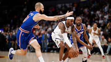 Feb 8, 2022; Denver, Colorado, USA; Denver Nuggets forward Will Barton (5) controls the ball under pressure from New York Knicks guard Evan Fournier (13) and guard Kemba Walker (8) in the first quarter at Ball Arena. Mandatory Credit: Isaiah J. Downing-Imagn Images