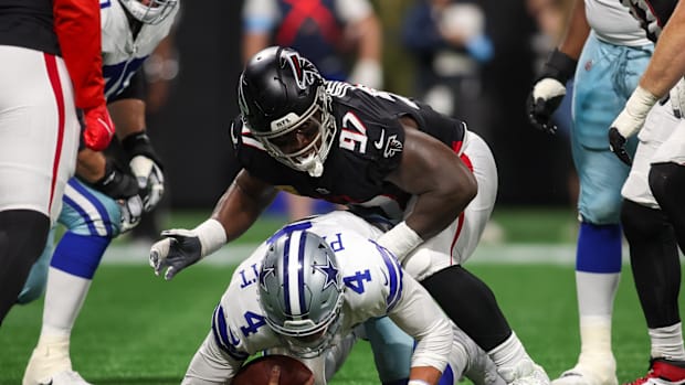 Grady Jarrett hauls down Dak Prescott for a sack against Dallas.