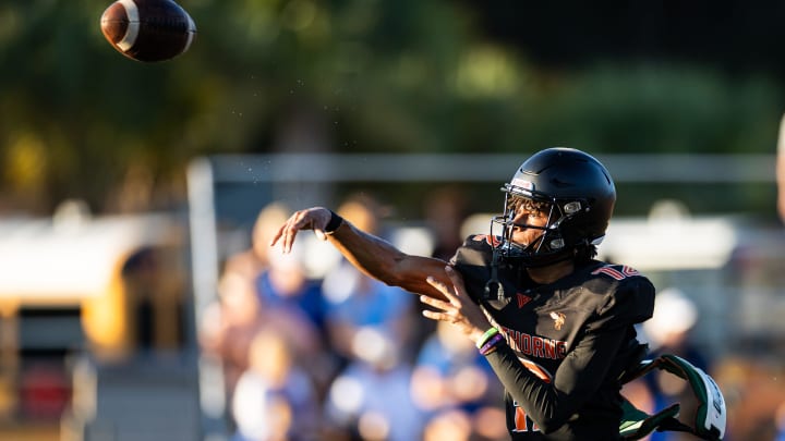 Hawthorne Hornets quarterback Adrian Curtis (12) throws the ball against the Newberry Panthers before the game at Hawthorne High School Football Stadium in Hawthorne, FL on Friday, August 30, 2024. [Matt Pendleton/Gainesville Sun]