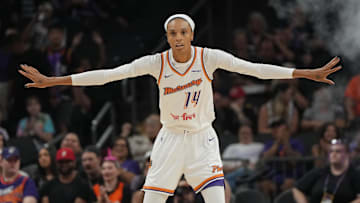 Aug 5, 2025; Phoenix, Arizona, USA; Phoenix Mercury forward DeWanna Bonner (14) plays defense against the Connecticut Sun in the first half at Footprint Center. Mandatory Credit: Rick Scuteri-Imagn Images